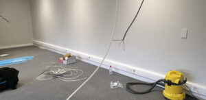 Skirting board level trunking with power and data ports